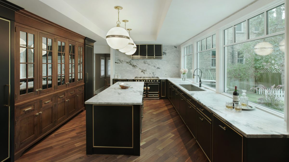 contemporary black and wood kitchen with brass metal details