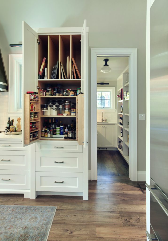 white kitchen wood interior cabinets with tray organization