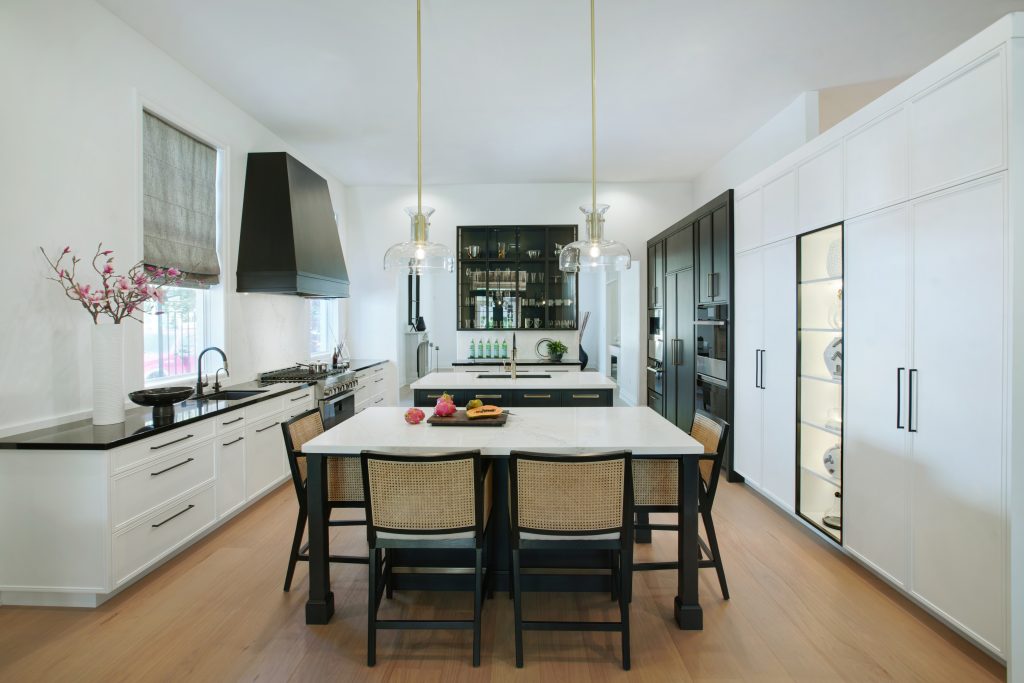white and black transitional kitchen with dual islands
