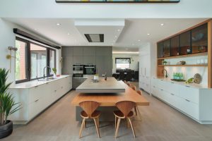 white grey and wood contemporary kitchen with cooktop