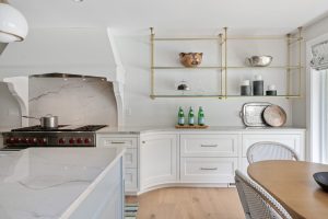 open shelving white kitchen with gold