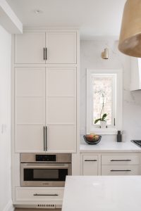 white tall cabinets in kitchen