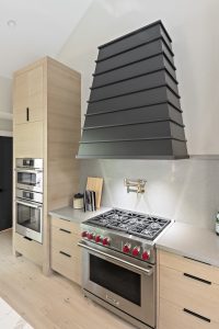 black hood with light cabinets