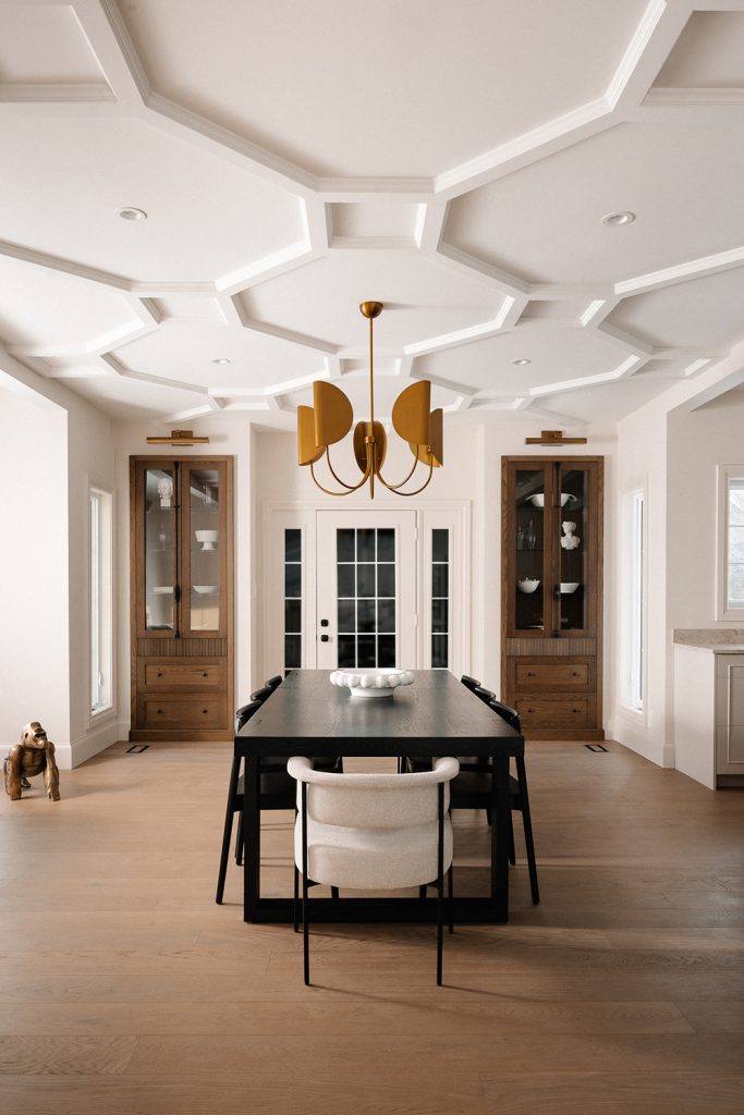 Dining room with dramatic ceiling detail and matching white oak cabinets