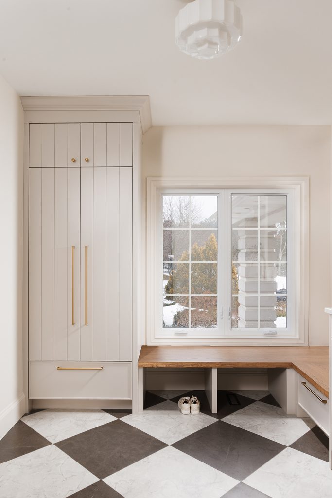 Laundry mudroom combination with closet cabinet and bench