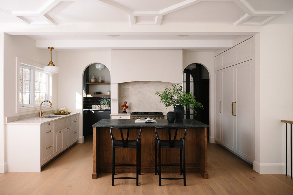 White oak island with white painted cabinets