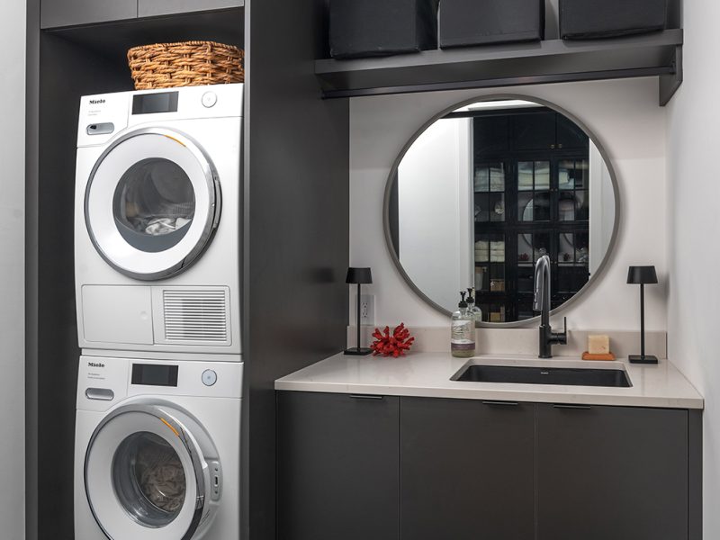 Black laundry room cabinets