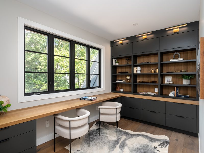 Black home office with wood interior open shelves