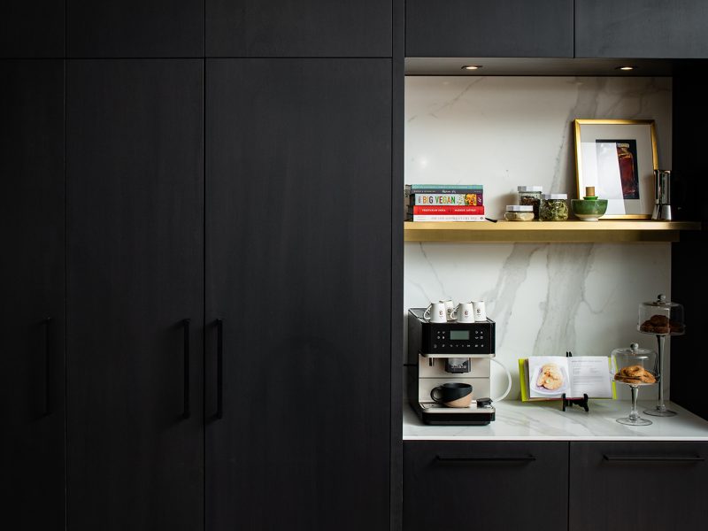 White stone cubby with coffee station and shelf