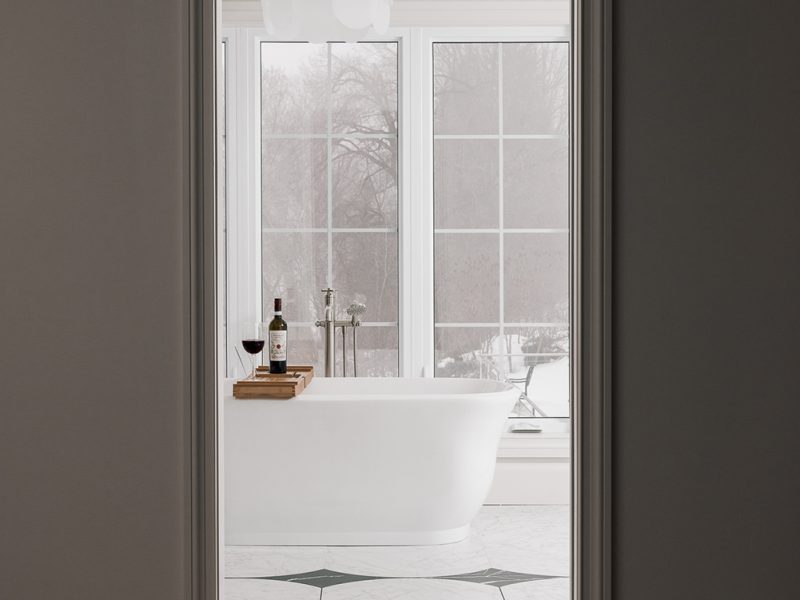 Primary ensuite entry with custom floor detail