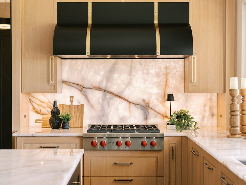 black and gold custom range hood