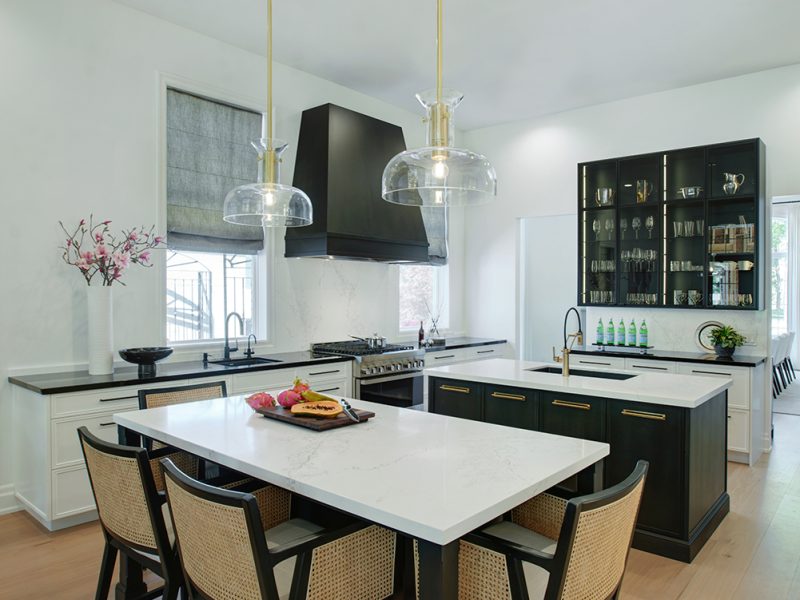 Dual kitchen islands with seating and work station
