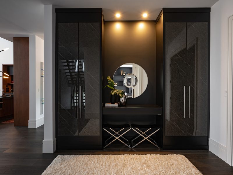 Entryway cabinets with seating area and closet