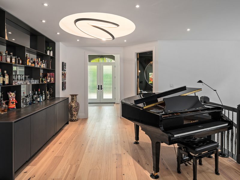 Entryway with bar and piano