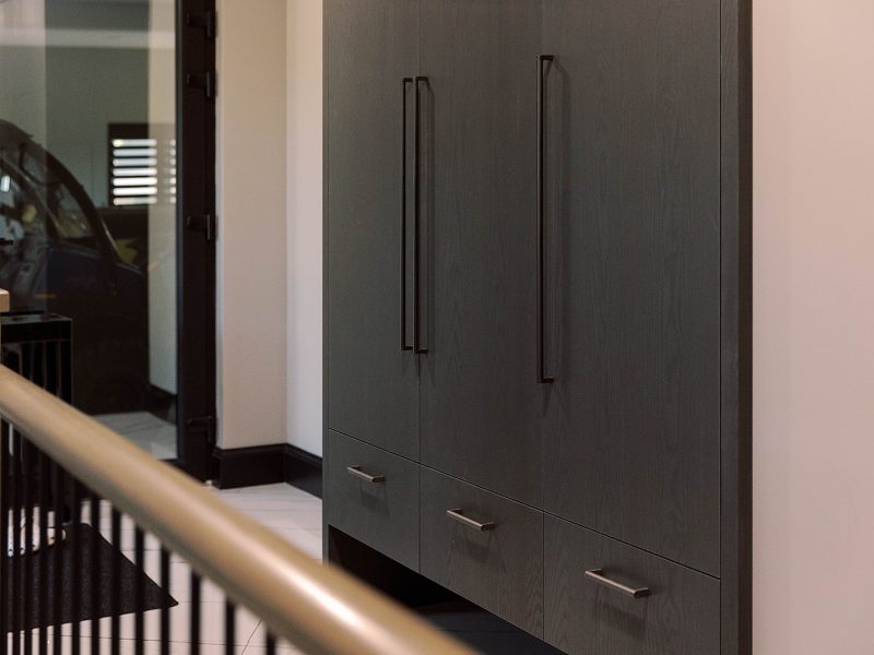 Black stained entryway closet cabinets