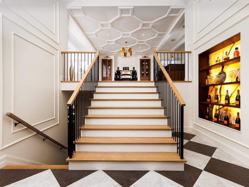 Foyer with checkerboard flooring and wine display