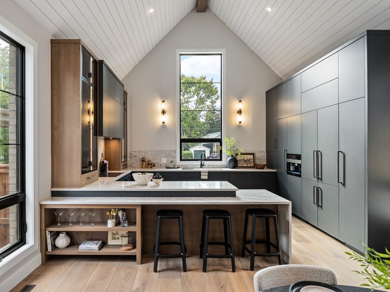 Painted grey kitchen cabinets with walnut accents