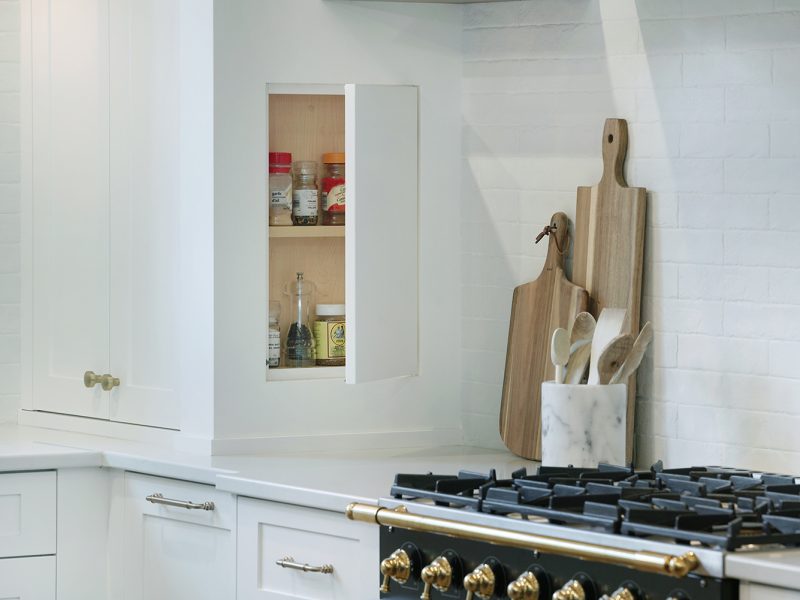 Hidden spice storage beside range