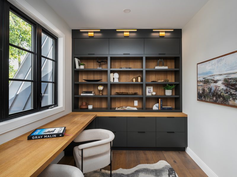 Dark painted office cabinets with wood interior