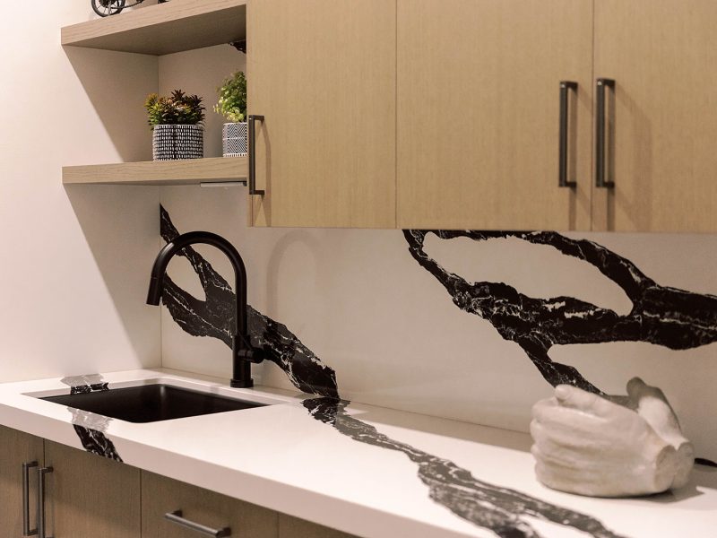 Black and white countertop and sink in laundry room
