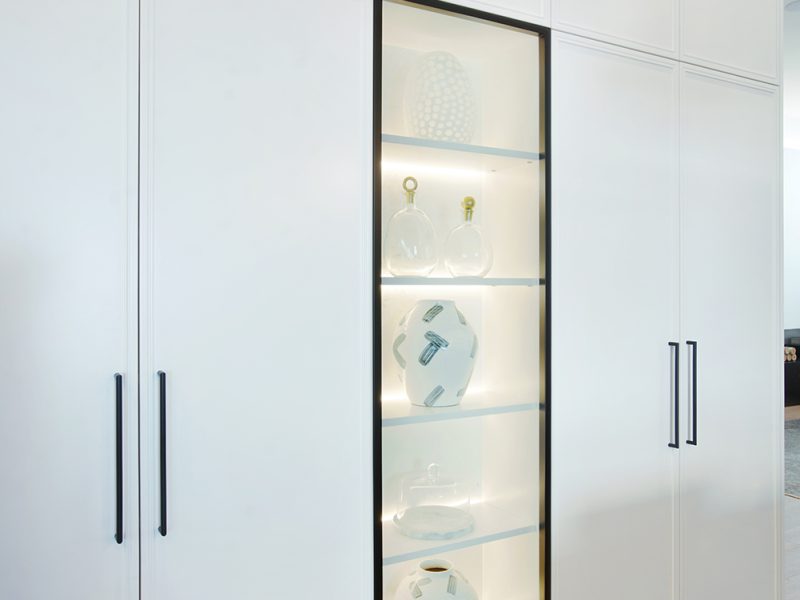 Long glass display cabinet in kitchen