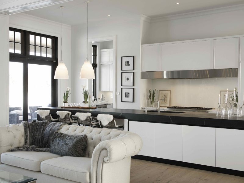 Modern kitchen with black and white cabinets