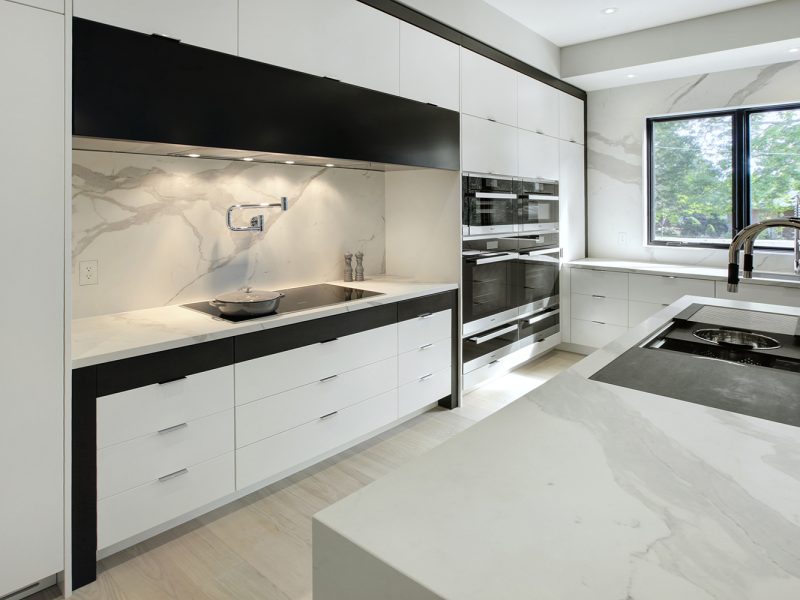Modern minimalist kitchen with hidden range hood