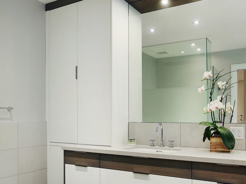 Modern primary ensuite with white and wood vanity