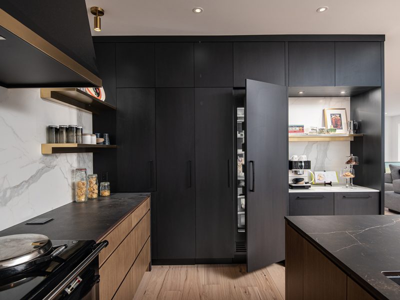 Panel ready refrigerator with black cabinets