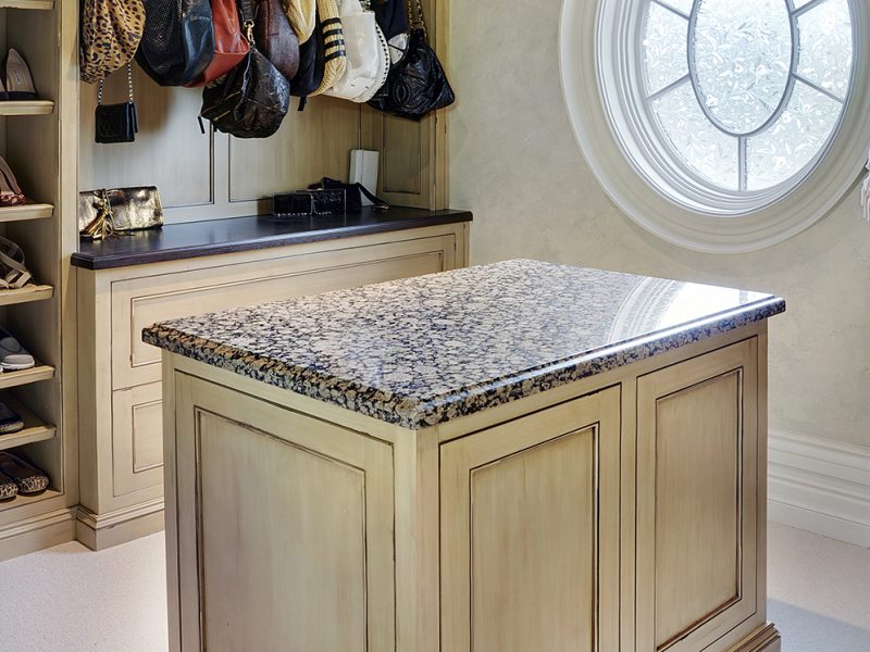 Traditional walk-in closet with island