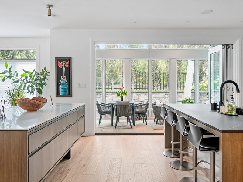 Dual islands leading into sunroom