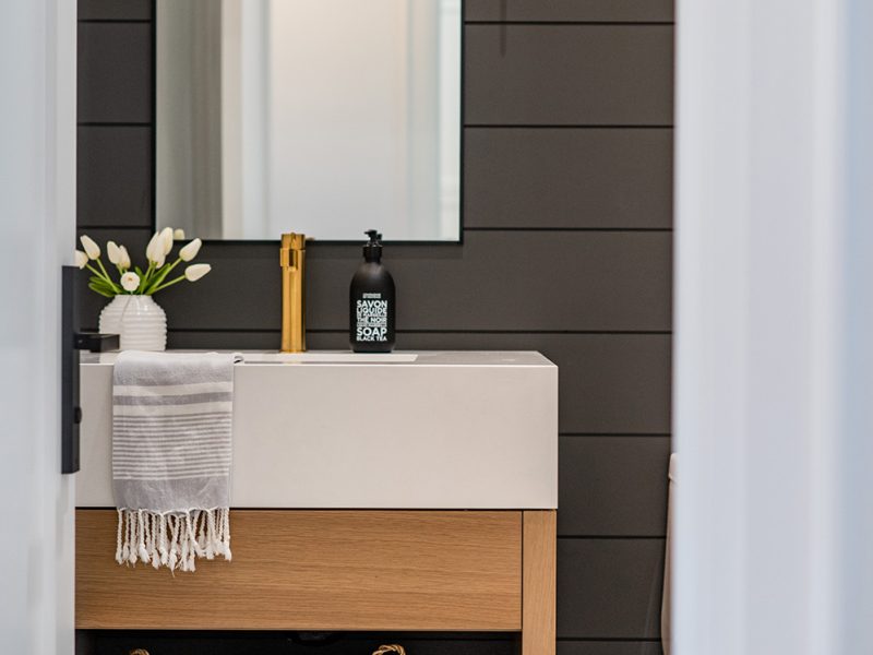 Vessel sink on vanity in powder room