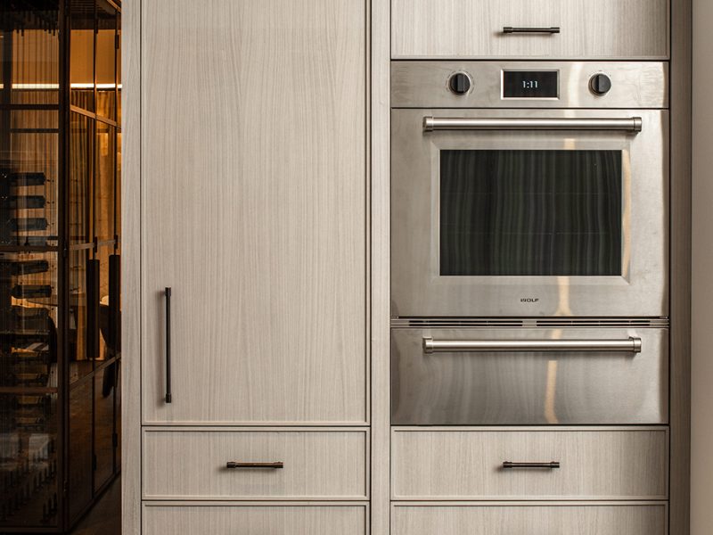 Wall oven around light wood cabinets