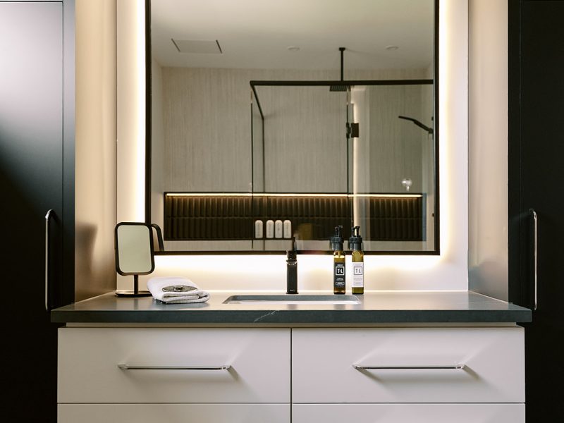 White ensuite vanity with black countertop