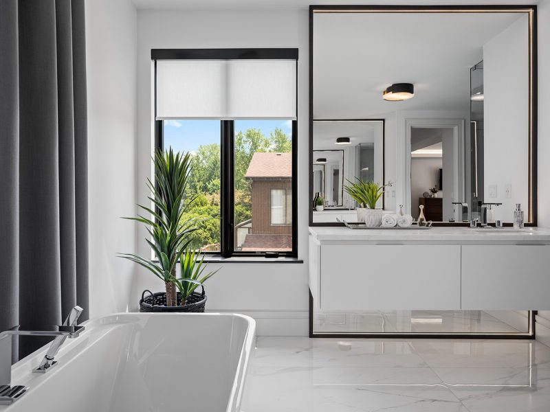 White floating vanity with giant mirror