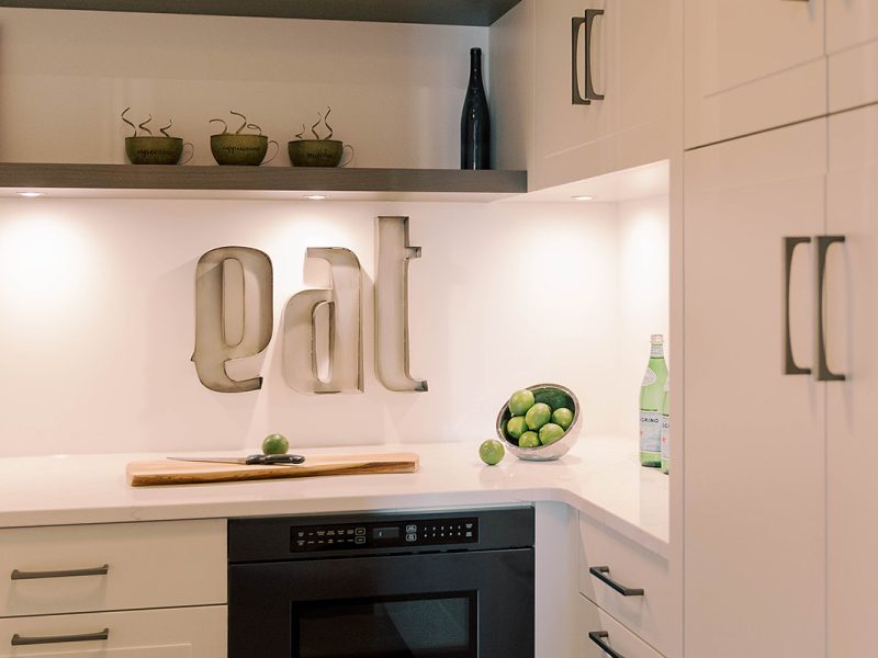 White walk-in pantry cabinets with open shelving
