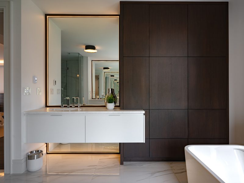 White modern vanity with walnut linen cabinet