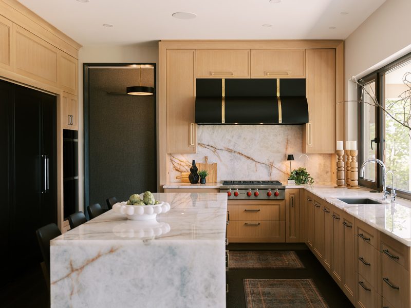 Taj Mahal waterfall countertop white oak kitchen cabinets
